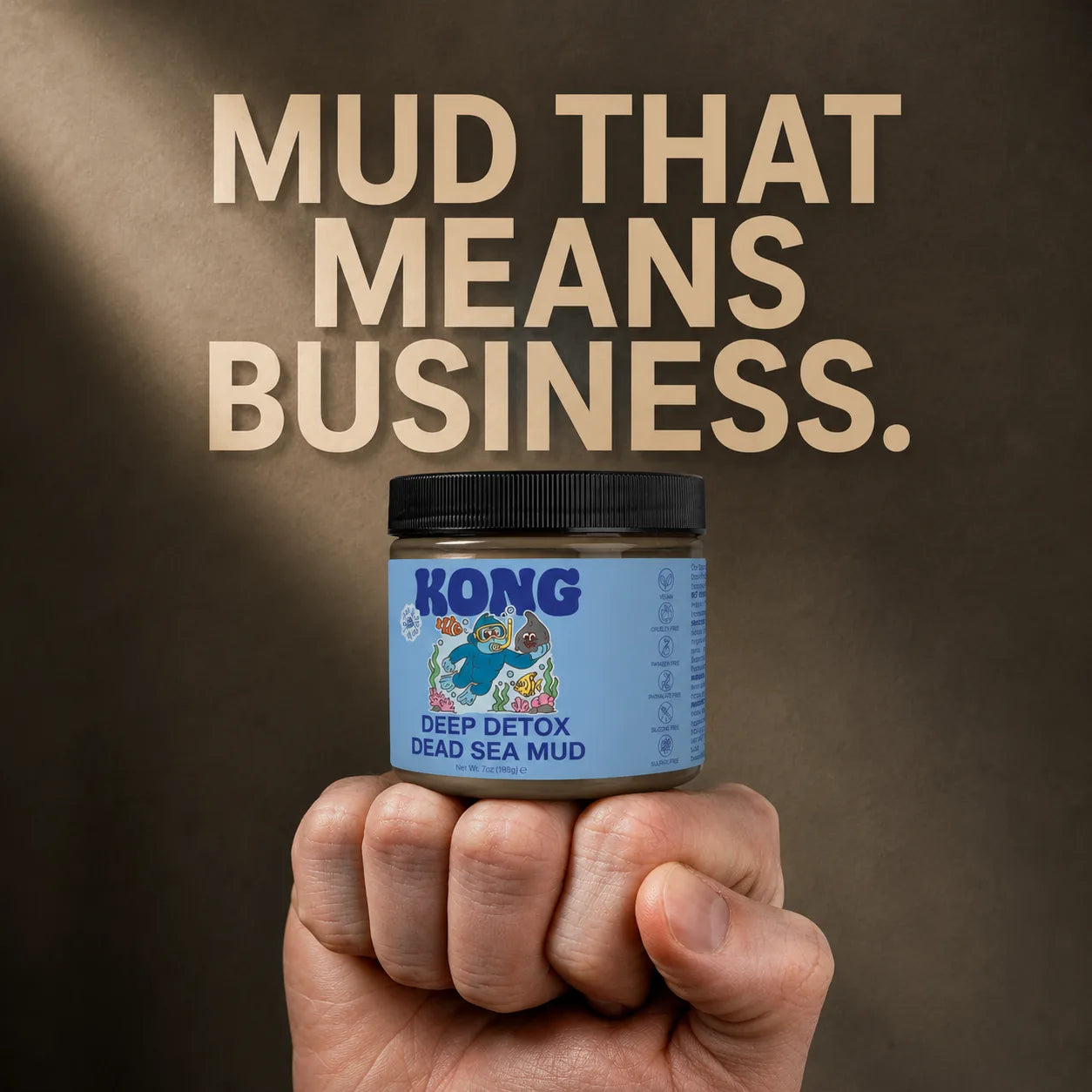 KONG Dead Sea Mud jar held in a fist