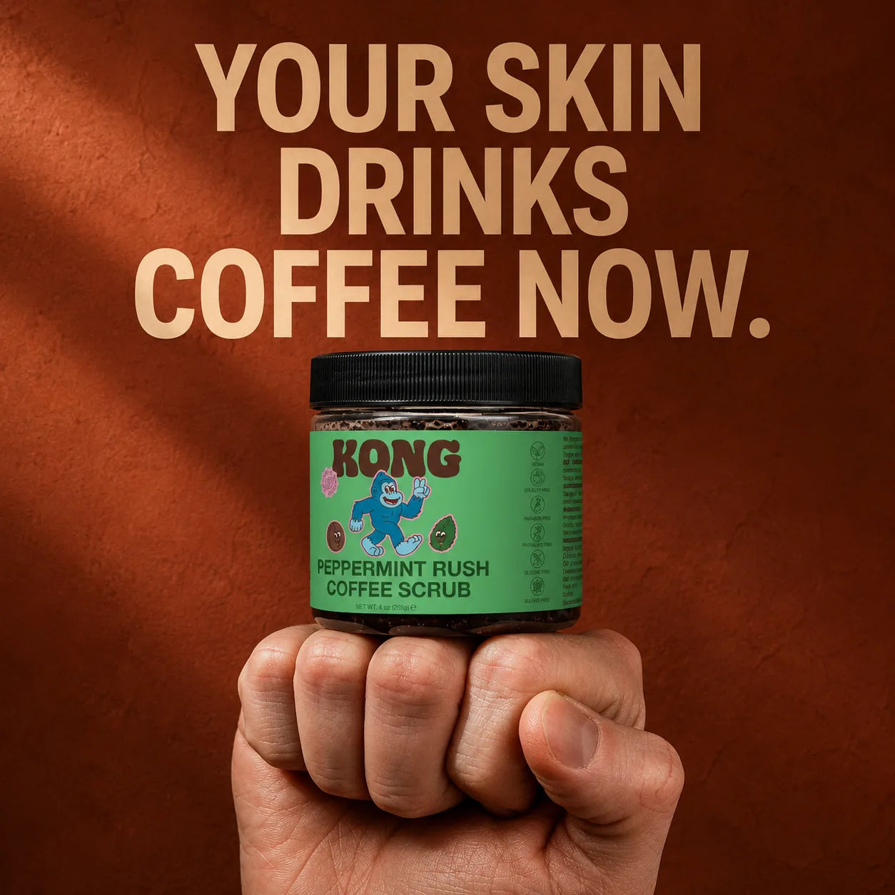 KONG Peppermint Rush Coffee Scrub jar held in a fist